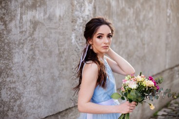Wedding bouquet in girl's hands.