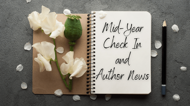 open journal with rose petals and pencil. text says midyear check in and author news