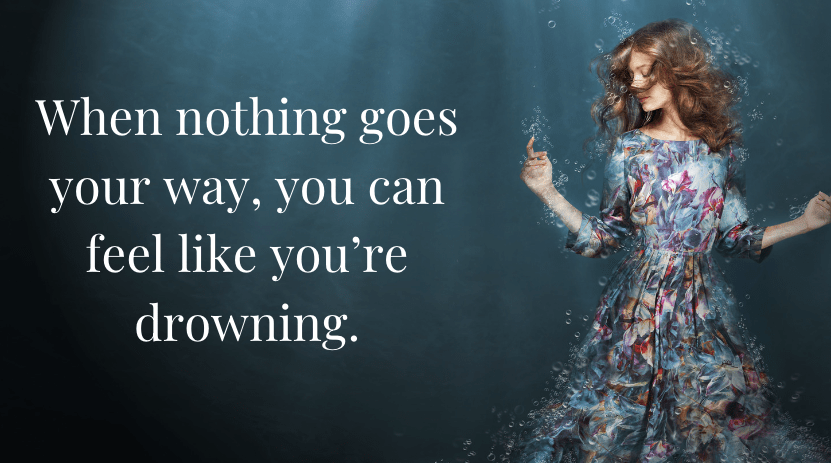 woman wearing floral dress under water. text says: when nothing goes your way, you can feel like you're drowning