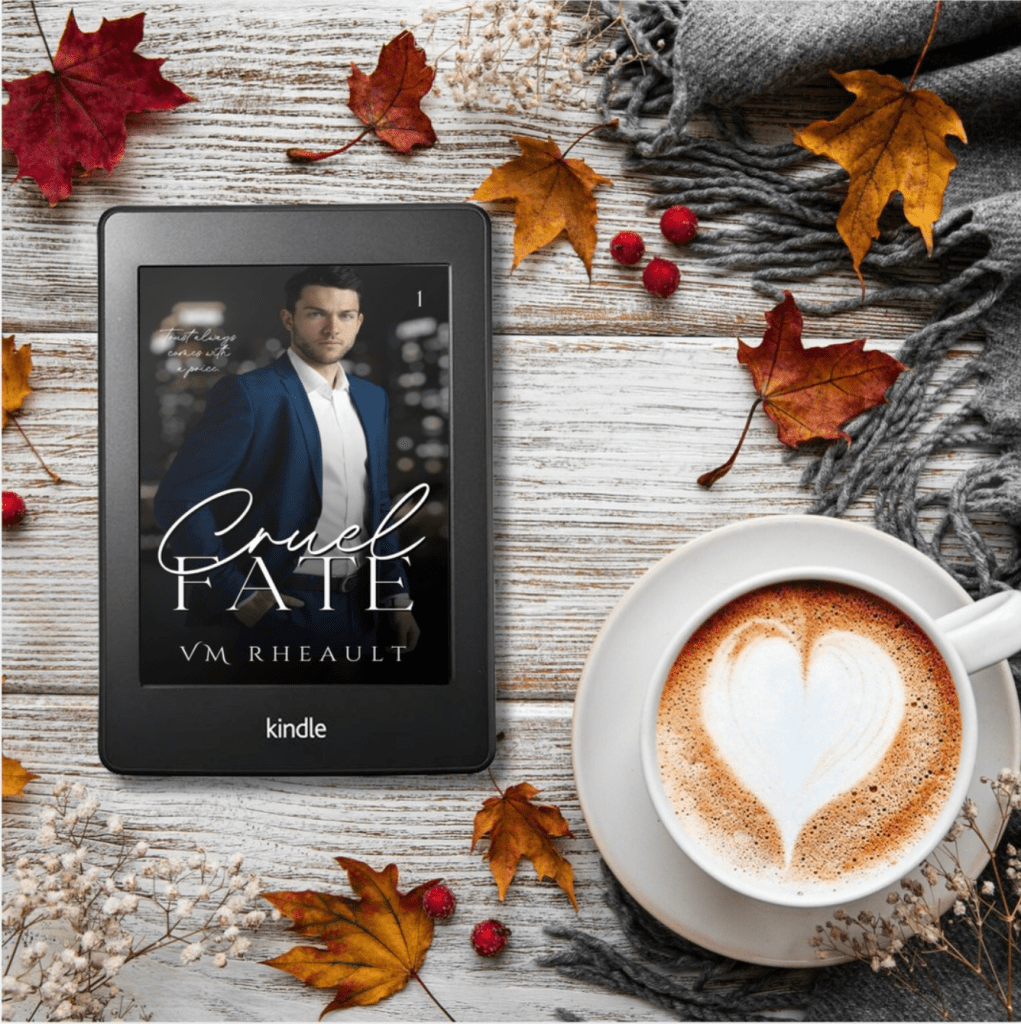 flat lay of wood wht autumn leaves and a blue scarf. cup of cappuccino that has a foam heart
also Cruel Fate's book cover on a kindle device