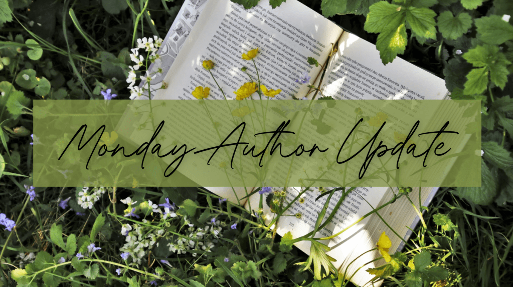 open hardcover book laying in flowers, clover, and grass. text says, Monday Author Update