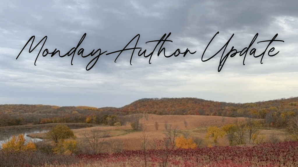 higher view of a state park in autumn. browns dull greens and oranges over a hilly field. lake to the left a murky green water. 