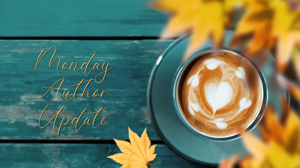 A fall-themed graphic featuring a cup of cappuccino with heart-shaped latte art on a teal saucer, resting on a rustic turquoise wooden table. Golden autumn leaves decorate the foreground and upper-right corner. Elegant gold script on the left reads “Monday Author Update.”