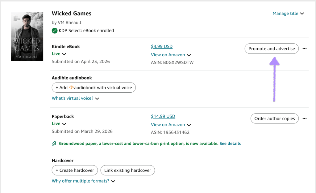Screenshot of the Amazon KDP Bookshelf showing Wicked Games by VM Rheault. The Kindle eBook is live at $4.99 and enrolled in KDP Select, while the paperback is live at $14.99. A purple arrow points to the “Promote and advertise” button beside the Kindle eBook listing.