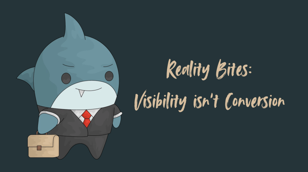 Blog graphic with a dark charcoal background. On the left, a cute cartoon blue shark wears a black business suit, white shirt, and red tie while carrying a tan briefcase. On the right, beige brush-script lettering reads, “Reality Bites: Visibility isn’t Conversion.”